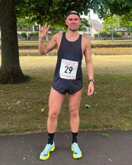 Paul after his marathon, wearing race bib 29